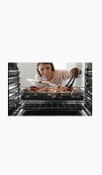 Icon of a woman checking her food in the oven.