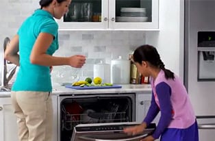 Clean up is Easy!- A video of a young girl and her mother making lemonade in the kitchen and easily wiping stains off of Frigidaire Gallery stainless steel appliances.