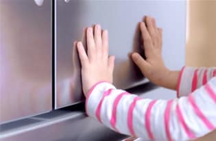 Fingerprints have met their match!-A video showing a little girl named Zoie making a mess in the kitchen and touching Frigidaire Gallery stainless steel appliances.