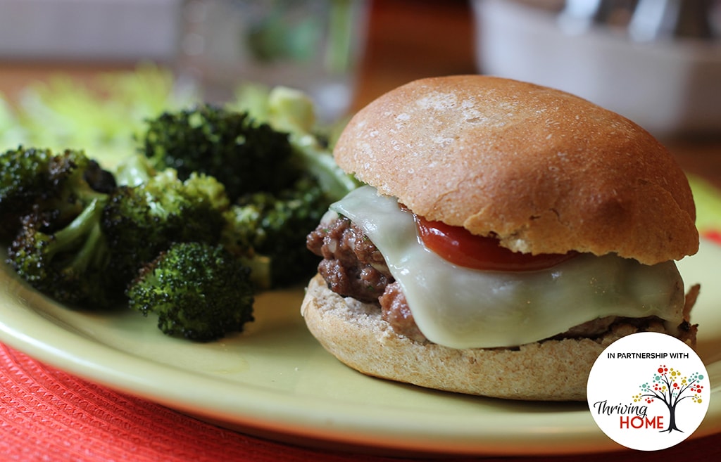 Ground-beef Italian Burger with minced garlic, parsley, grated parmesan cheese next to fresh broccoli on a plate.  Recipe calls for 10 ingredients, 12 minutes cooking time, 8 minutes prep time, and 6 servings.