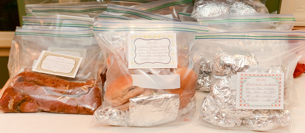 Plastic bags filled with meals and labeled with recipes.