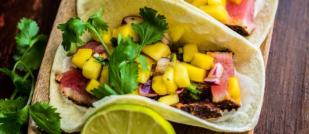 Seared Ahi Tuna & Mango Salsa in corn tortilla tacos.  Recipe calls for 19 ingredients, 15 minutes cooking time, 15 minutes prep time, and 4 servings.