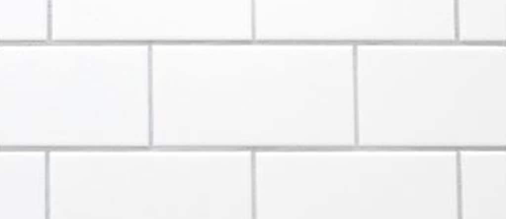 White tile kitchen wall.