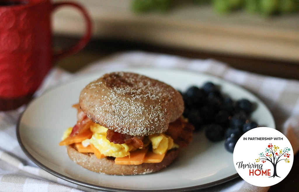 English Muffin Breakfast Sandwich with scrambled egg, cheddar cheese and bacon.  Recipe calls for 8 ingredients and 2 servings.