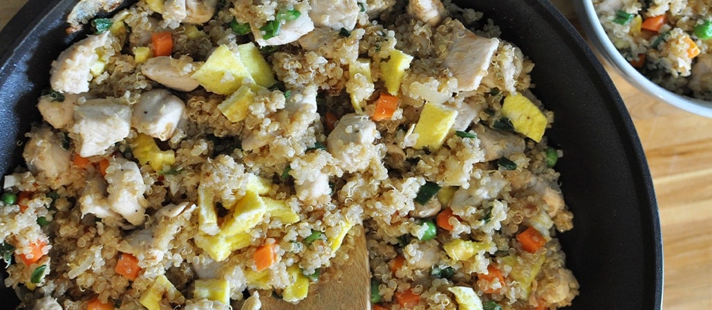 Chicken Fried Quinoa in a skillet.  Recipe calls for 10 ingredients, 25 minutes cooking time, 10 minutes prep time, and 4 servings.