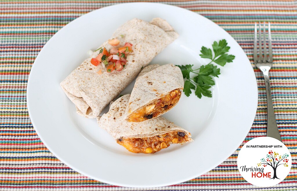 Chicken Burritos topped with cilantro and Pico de Gallo on a plate.  Recipe calls for 11 ingredients, 10 minutes cooking time, 10 minutes prep time, and 4 servings.