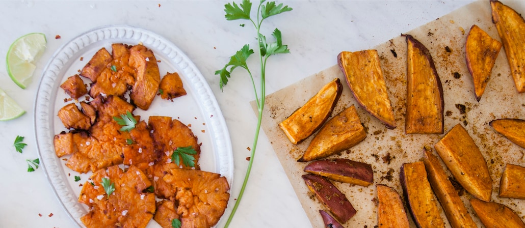 Roasted and Spiced Sweet Potatoes on a white serving dish.  Recipe calls for 6 ingredients, 50 minutes cooking time, 10 minutes prep time, and 4 servings.